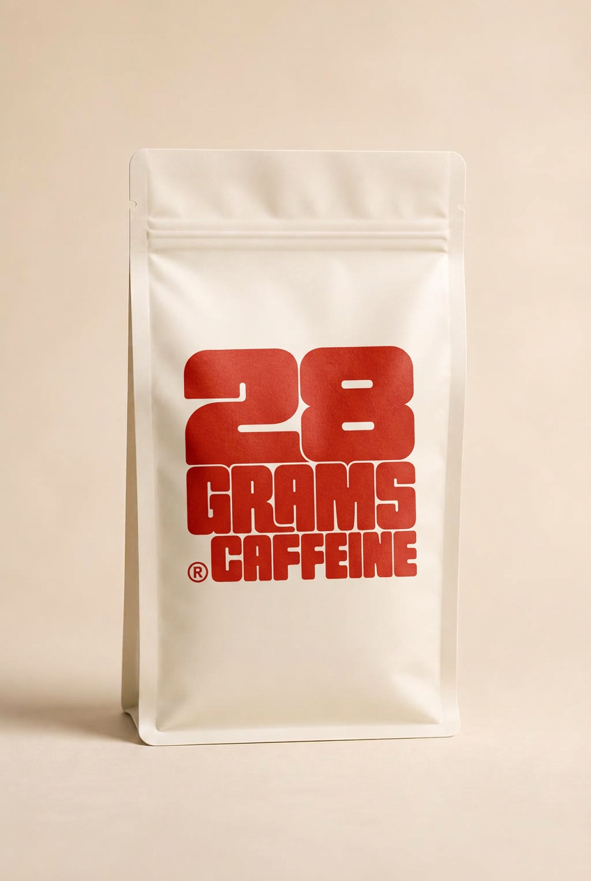 Off-white 28 Grams Caffeine coffee bag with red retro-futuristic wordmark